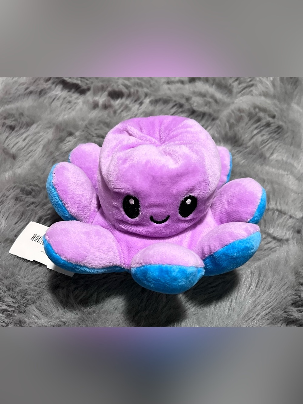 purple and blue reversible octopus plushie with a happy / angry face NWT